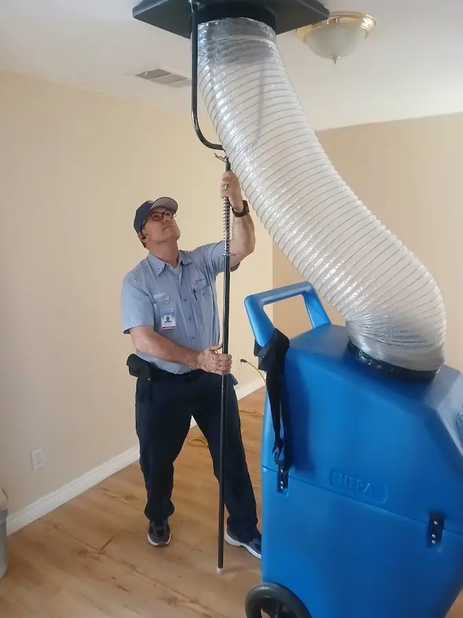 Furnace Tune-Up technician using HEPA equipment in Rancho Santa Margarita